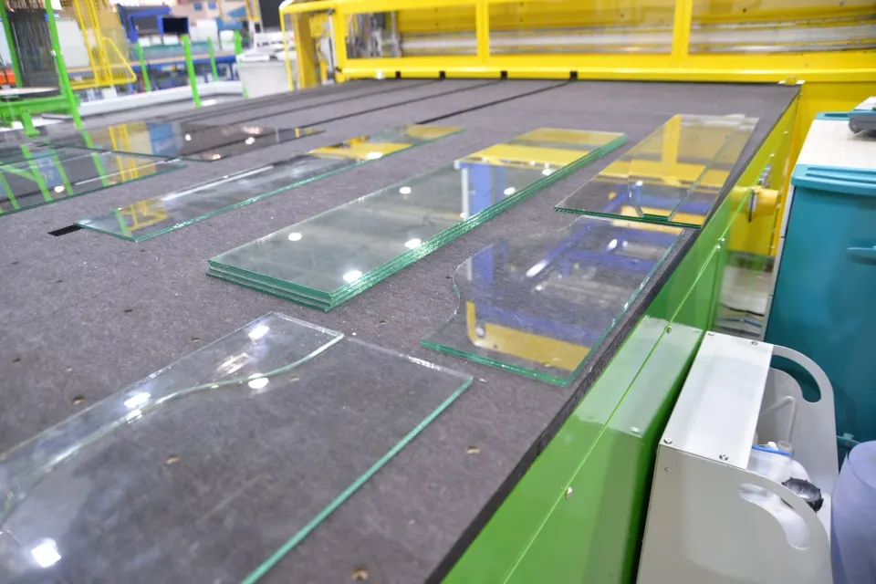 Laminated glass sheets processed with laser-assisted interlayer cutting.